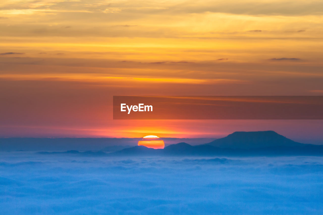 Scenic view of sea against romantic sky at sunset