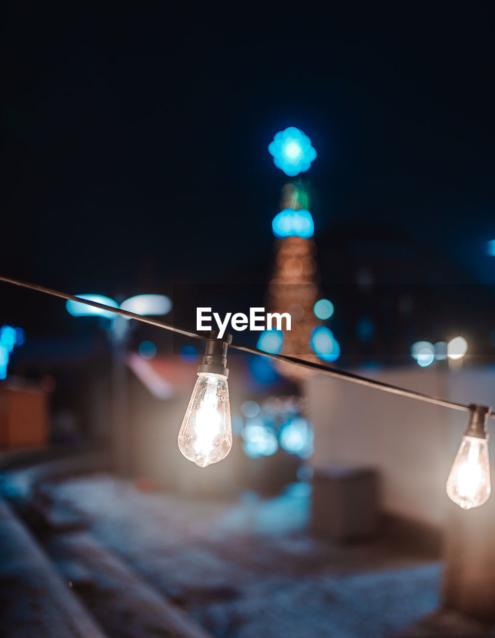 Low angle view of illuminated light bulb