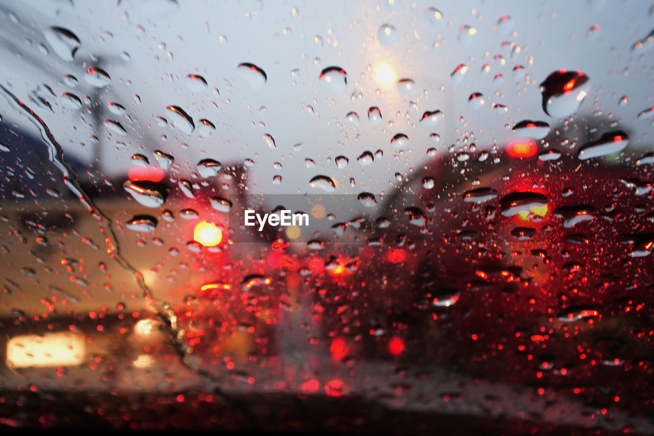 Water drops on the windshield. in the atmosphere of the road in the rain.