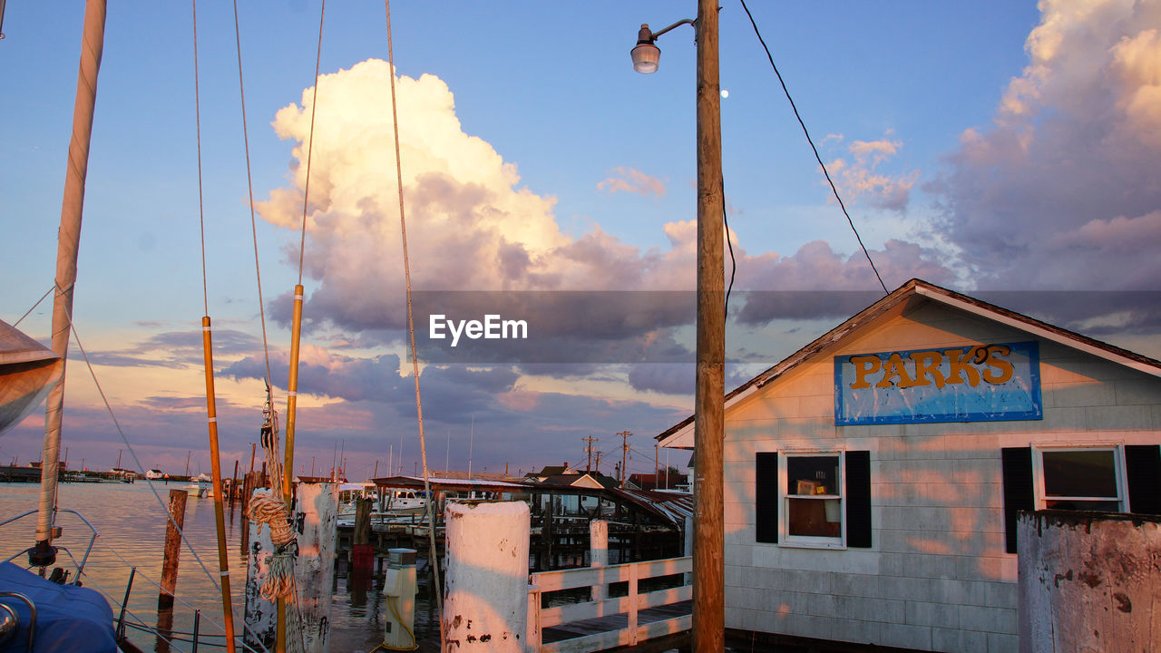 Tangier Island dock Chespeake Bay Tangier Island Building Exterior Commercial Dock Days End Type Image Sky Storm Clouds At Sunset Warf