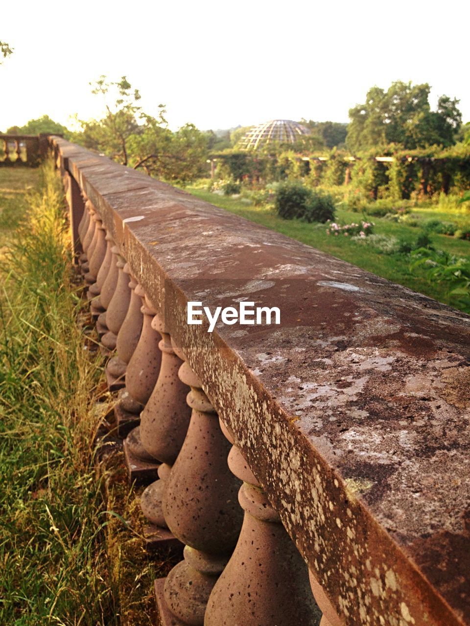 High angle view of fence on grassy field