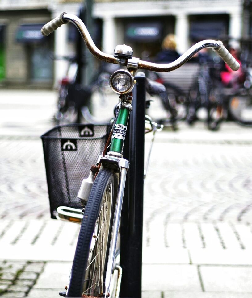 Close-up of a bicycle parked on street