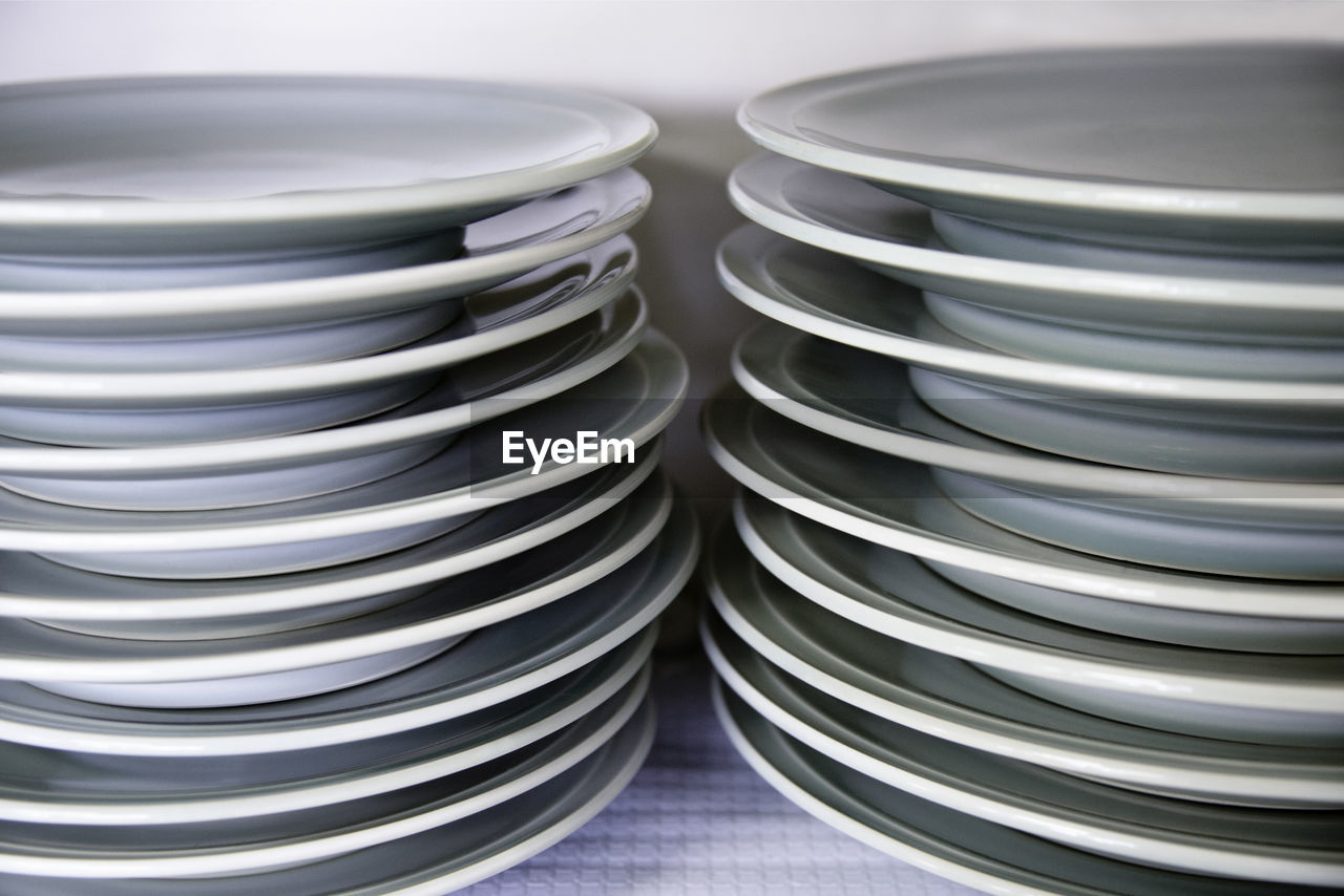 Close-up of stacked empty plates