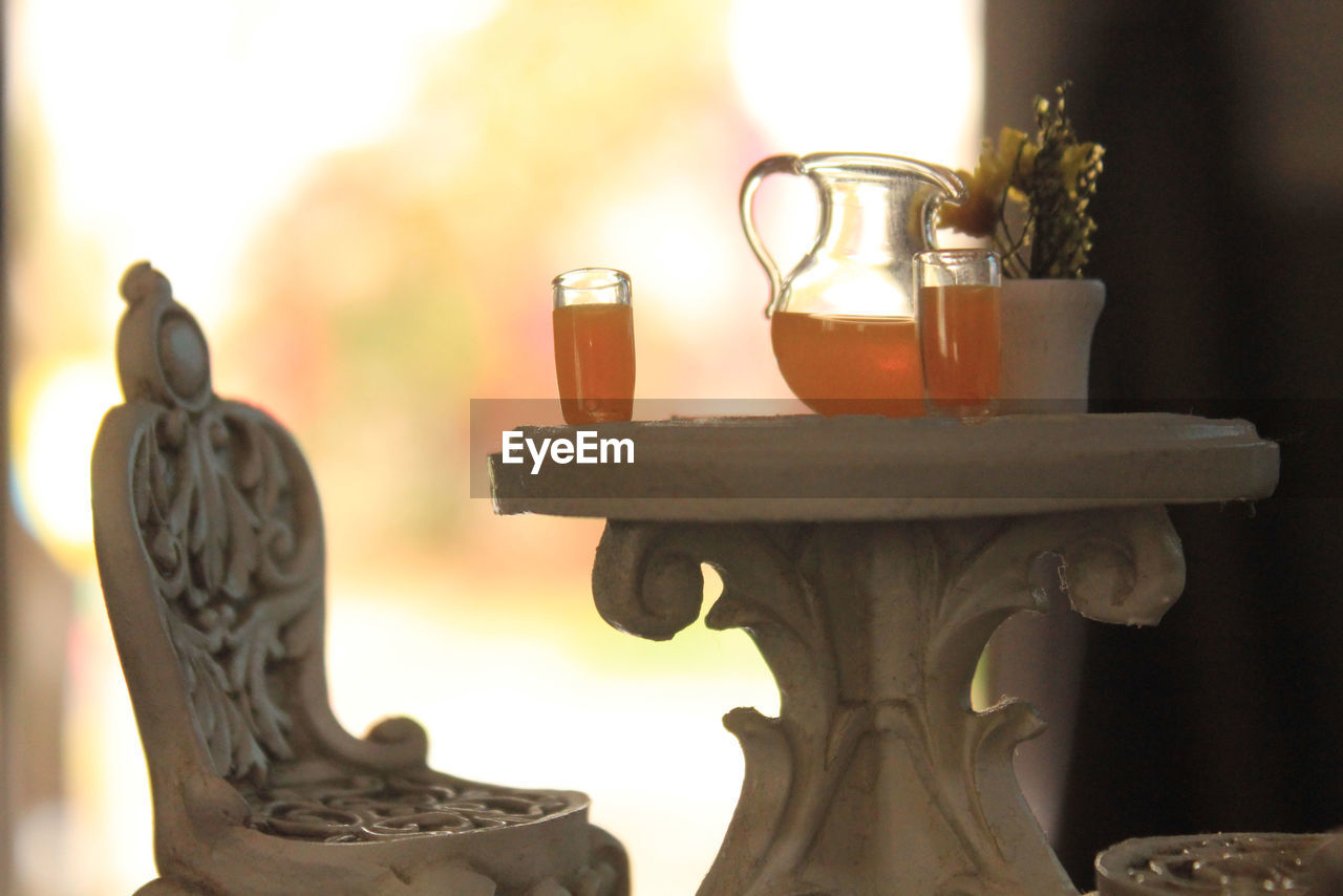 Close-up of orange juices on table