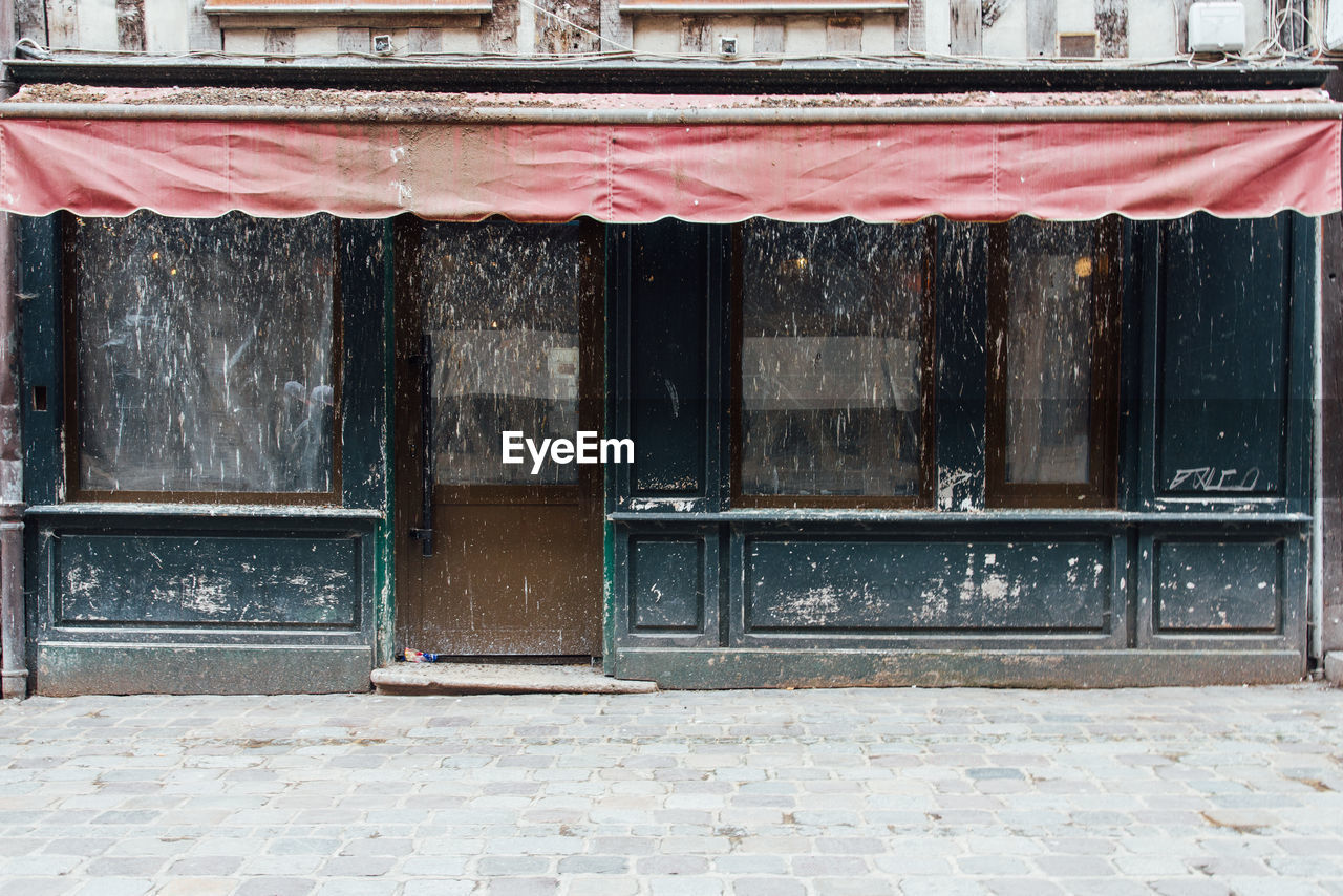 Abandoned shop. a weathered façade of an old shop. exterior of building 