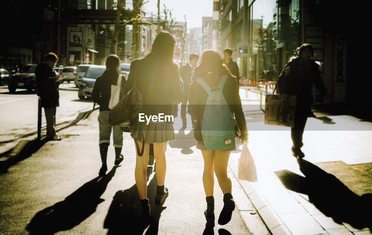 People walking on street in city