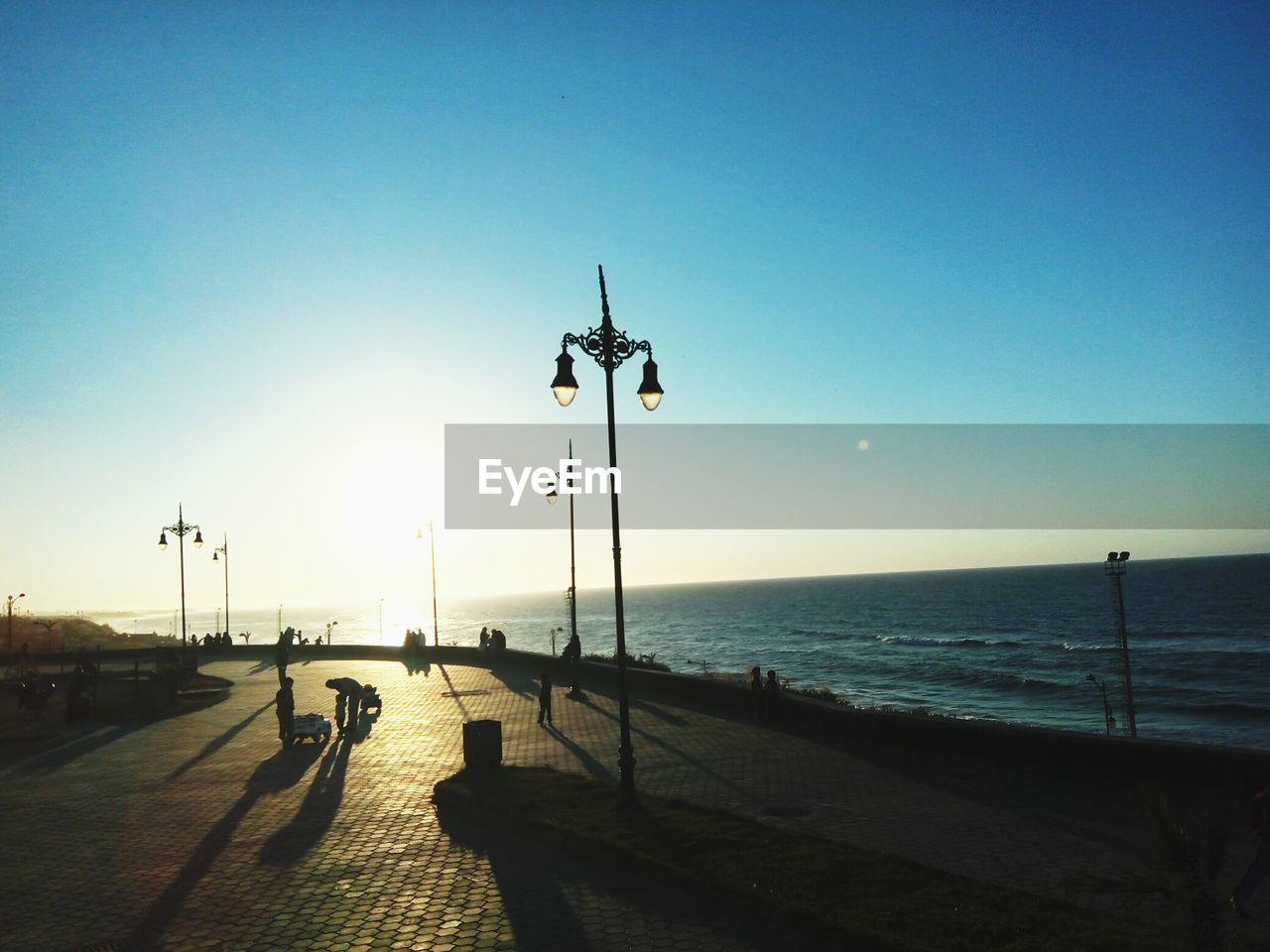 SCENIC VIEW OF SEA AT SUNSET