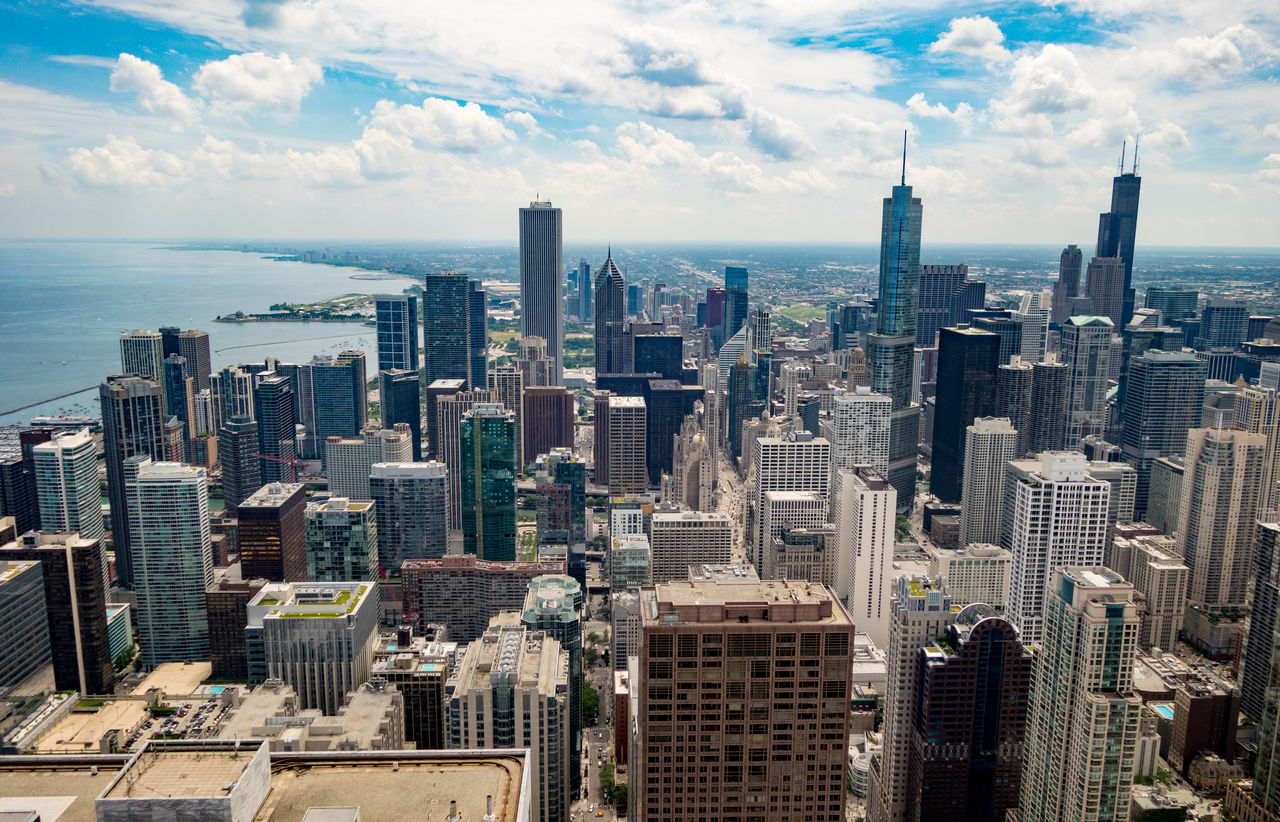 High angle view of cityscape against cloudy sky