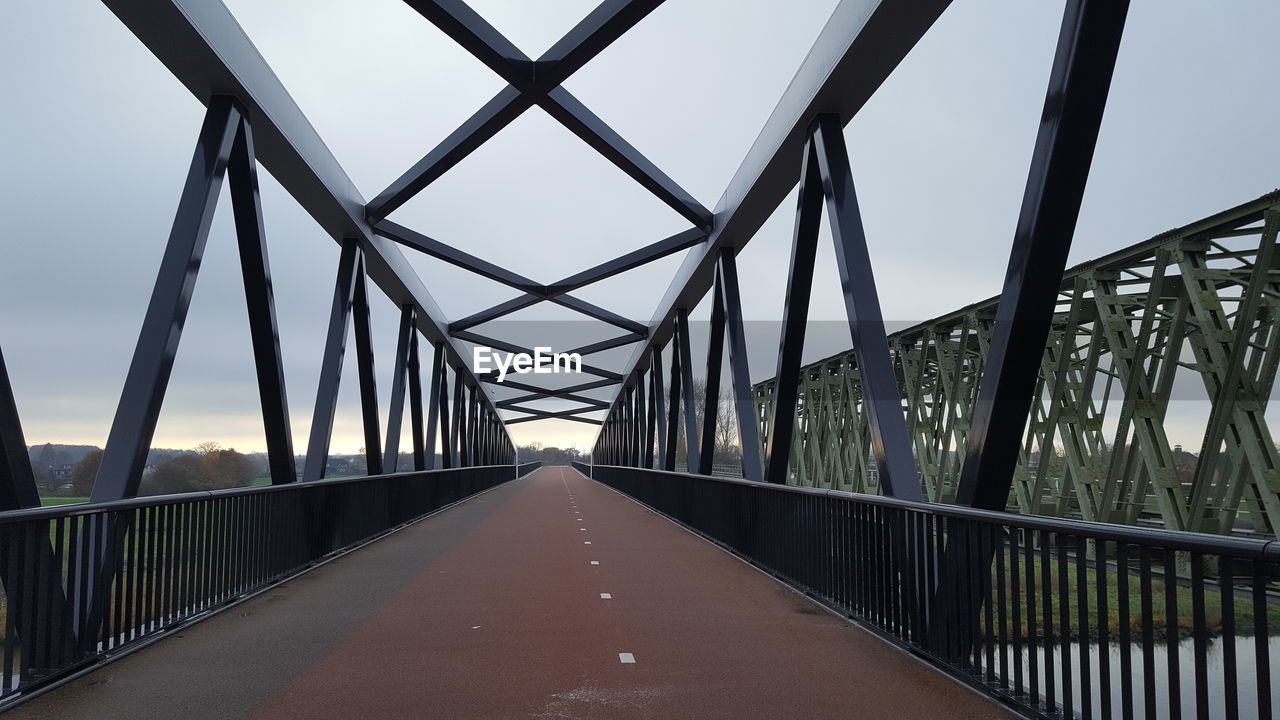 BRIDGE OVER ROAD AGAINST SKY