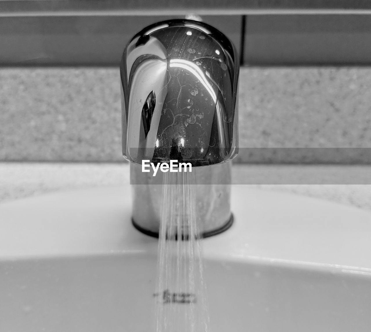 Close-up of running faucet