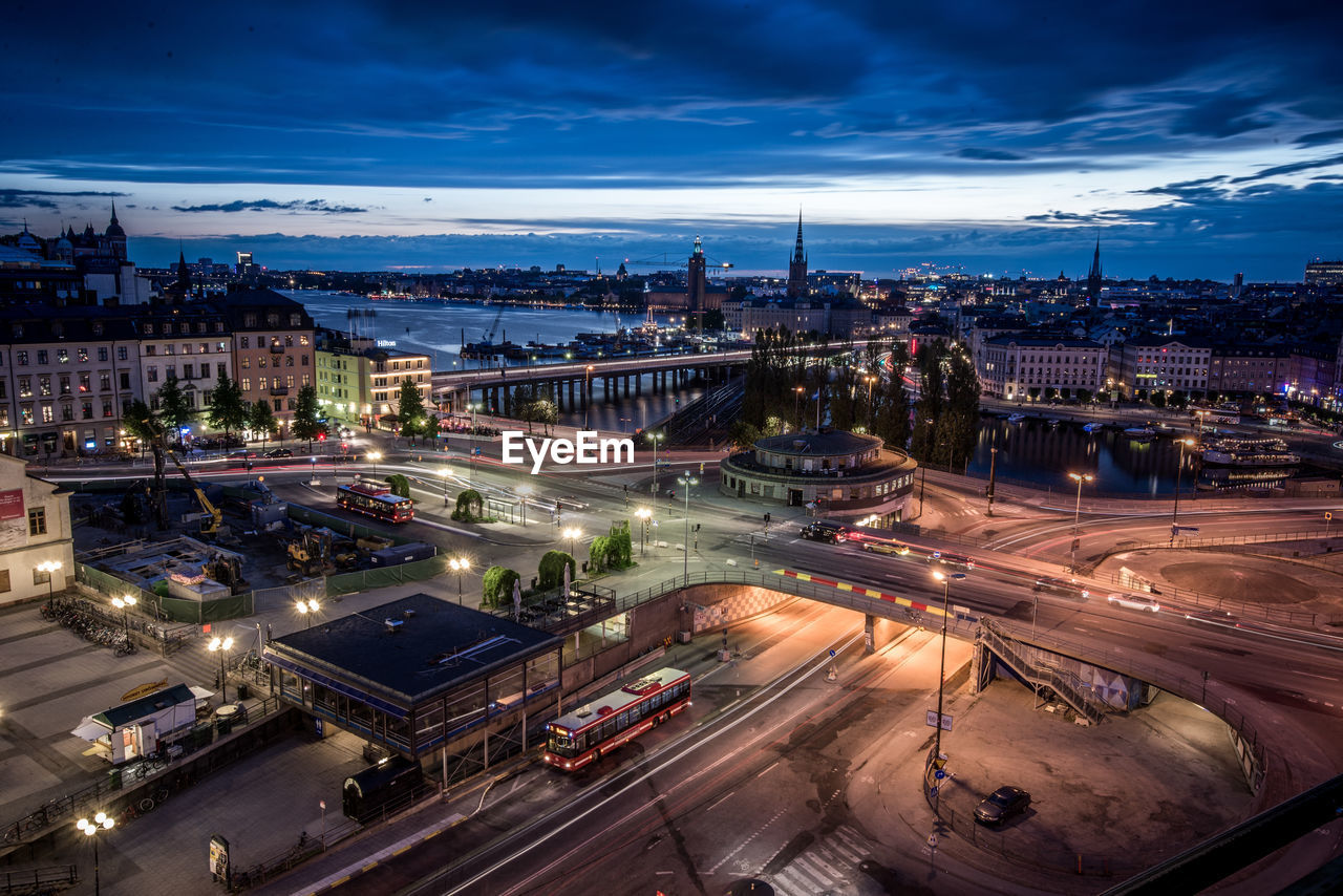 High angle view of illuminated city street against sky