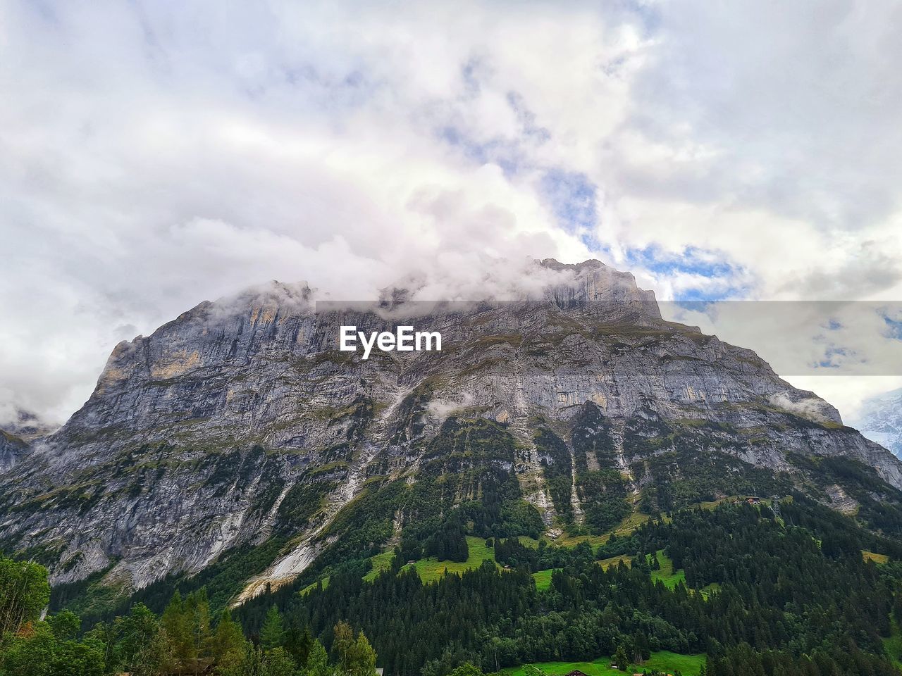 Low angle view of mountain range against sky