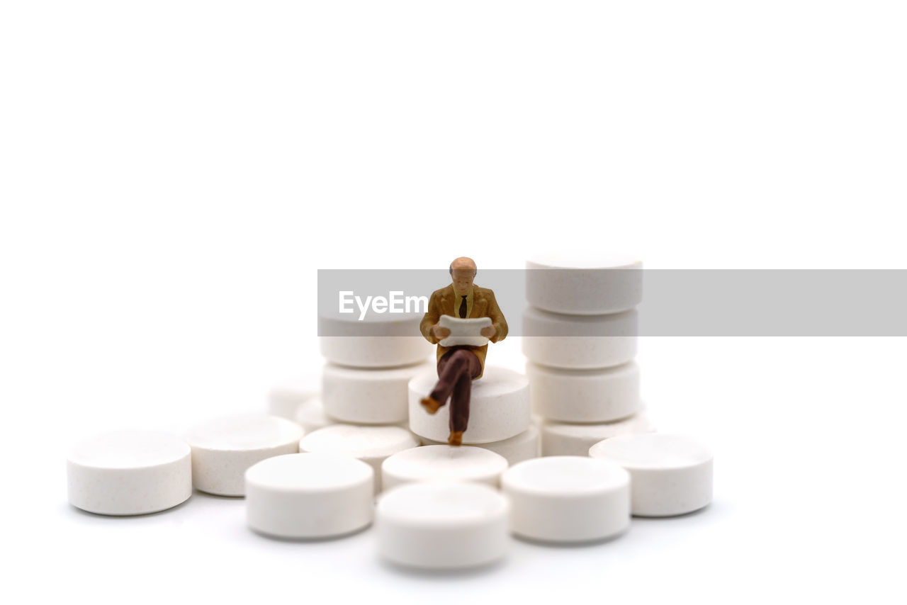 white background, healthcare and medicine, studio shot, business, copy space, pill, cut out, indoors, medicine, adult, dose, large group of objects, white