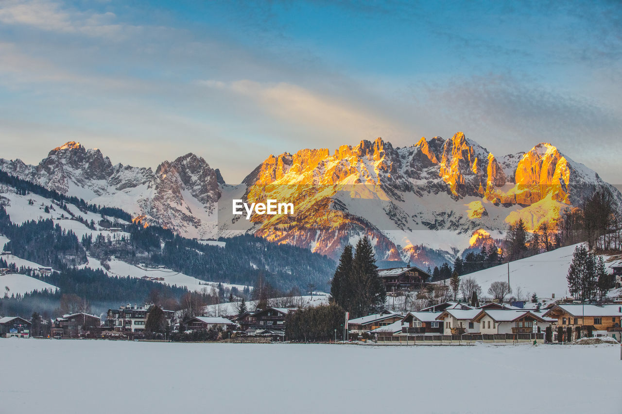 scenic view of snowcapped mountains against sky during sunset