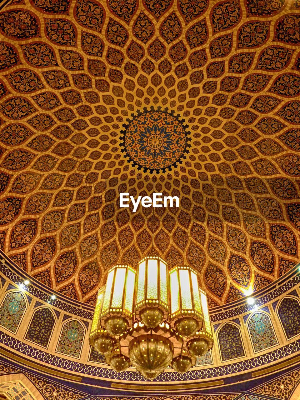 LOW ANGLE VIEW OF ILLUMINATED CEILING OF CATHEDRAL