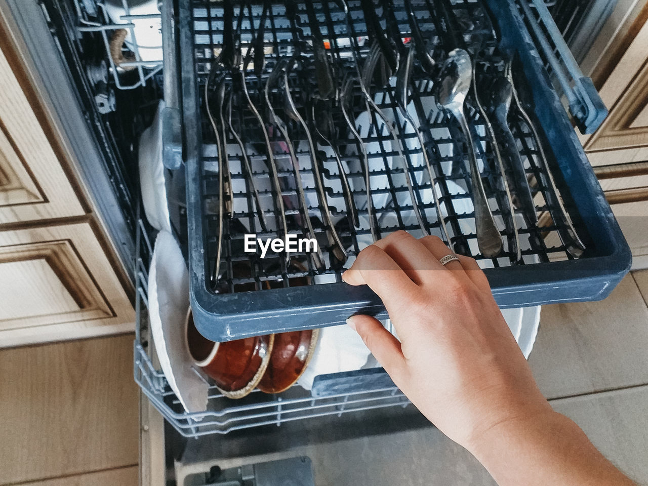 Open the dishwasher with clean dishes. the trend of cleaning and cleanliness.