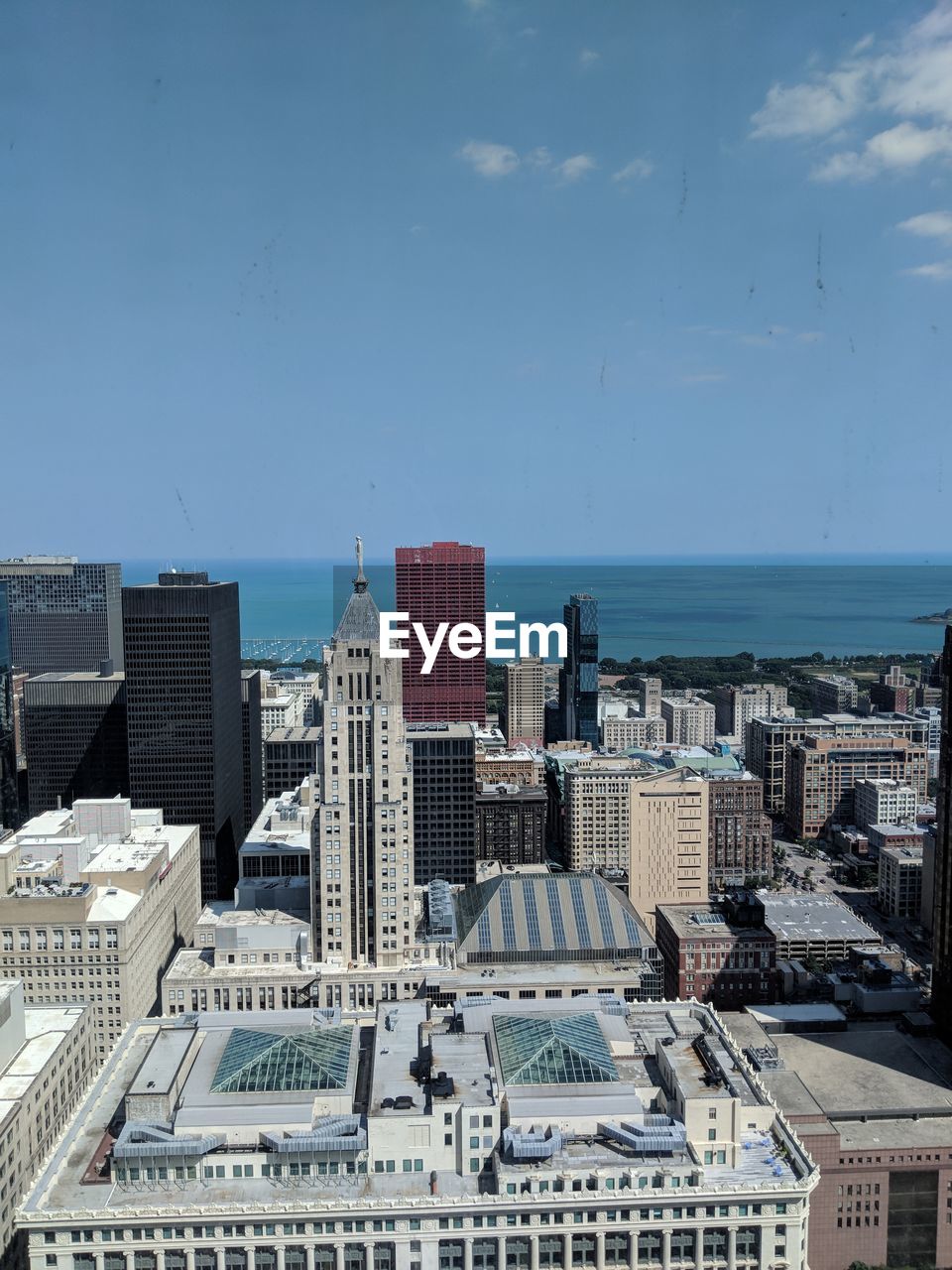 Cityscape and sea against sky