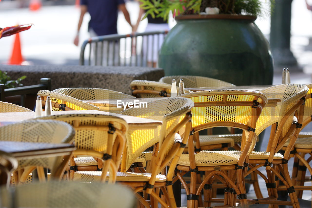 Empty chairs and tables at cafe