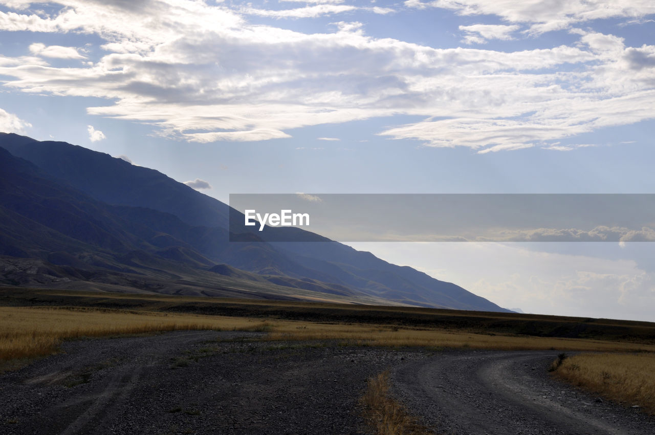 Scenic view of landscape and mountains against sky