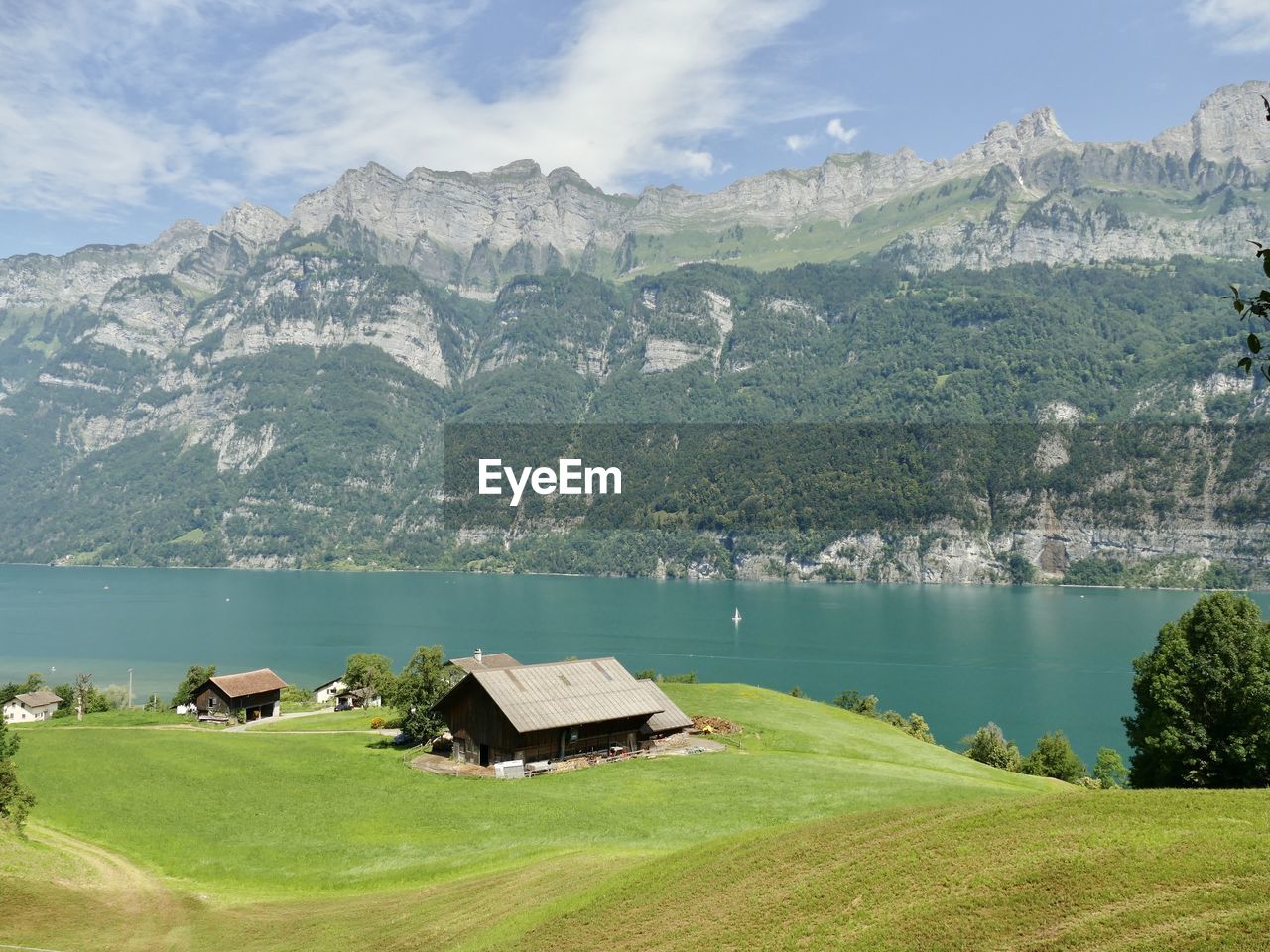 Scenic view of lake and mountains against sky