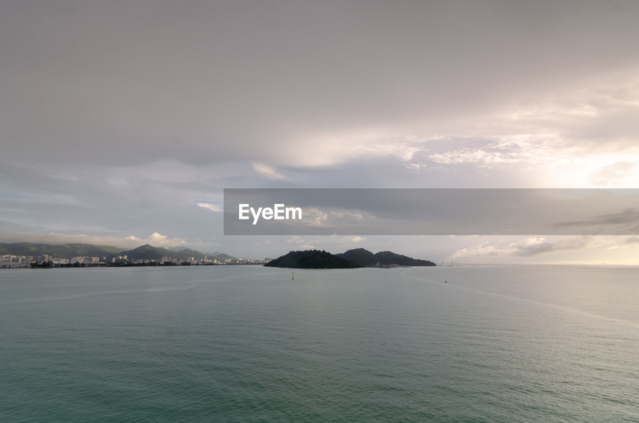 water, horizon, sky, sea, cloud, scenics - nature, beauty in nature, coast, ocean, nature, environment, mountain, tranquility, land, bay, travel destinations, tranquil scene, landscape, no people, body of water, travel, outdoors, shore, dramatic sky, seascape, beach, idyllic, dusk, tourism, island, coastline, day, architecture, cloudscape