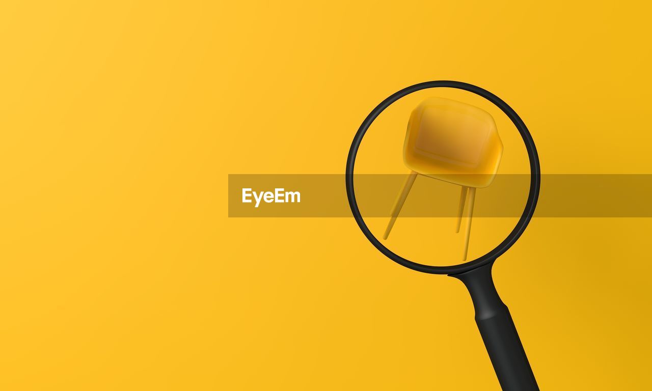 high angle view of stethoscope against yellow background