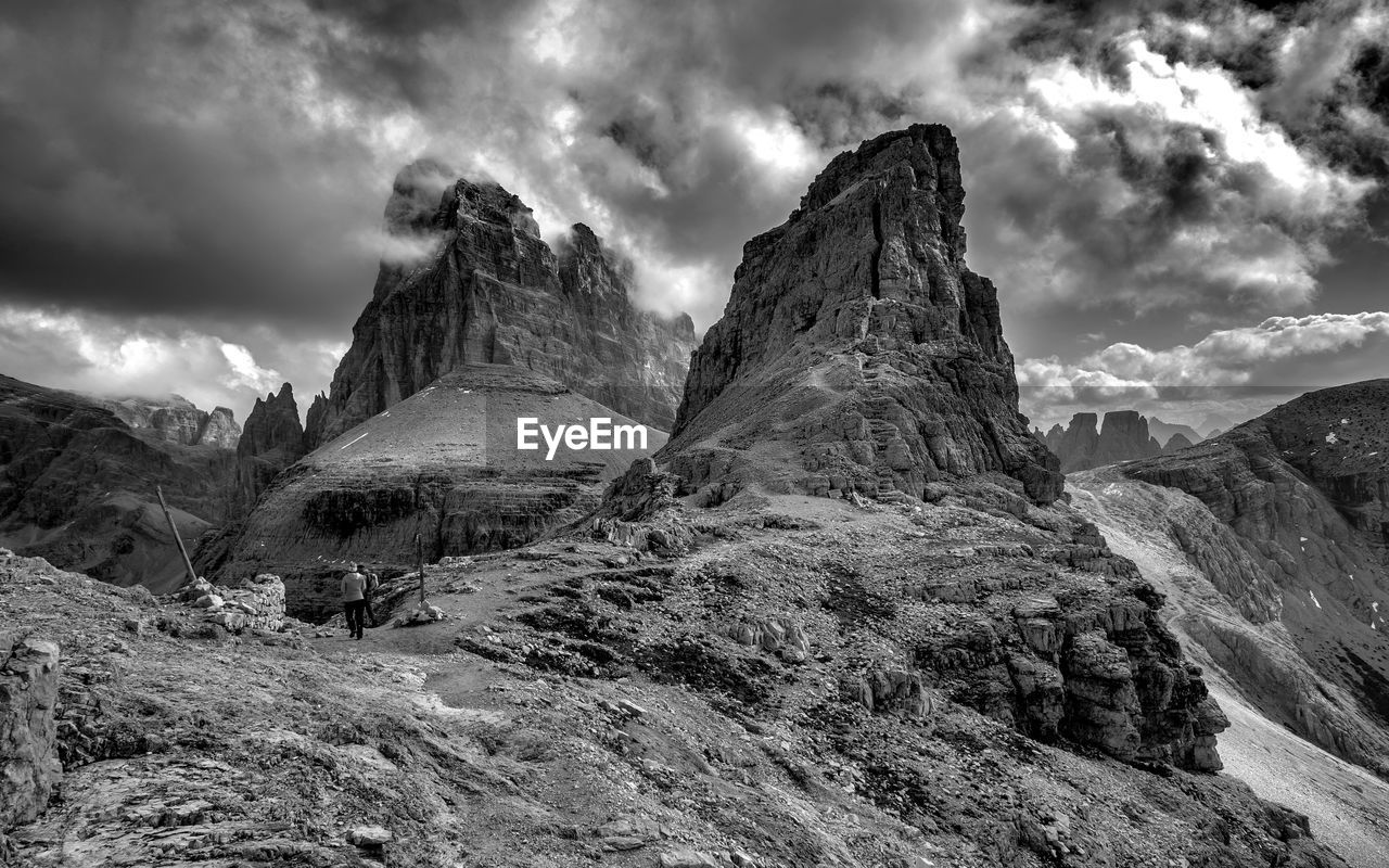 Scenic view of mountains against cloudy sky