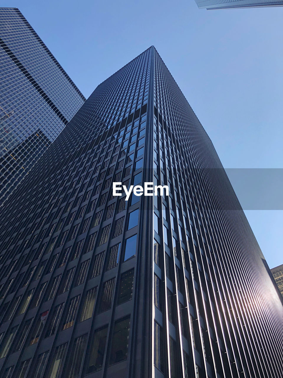 Low angle view of modern building against clear sky