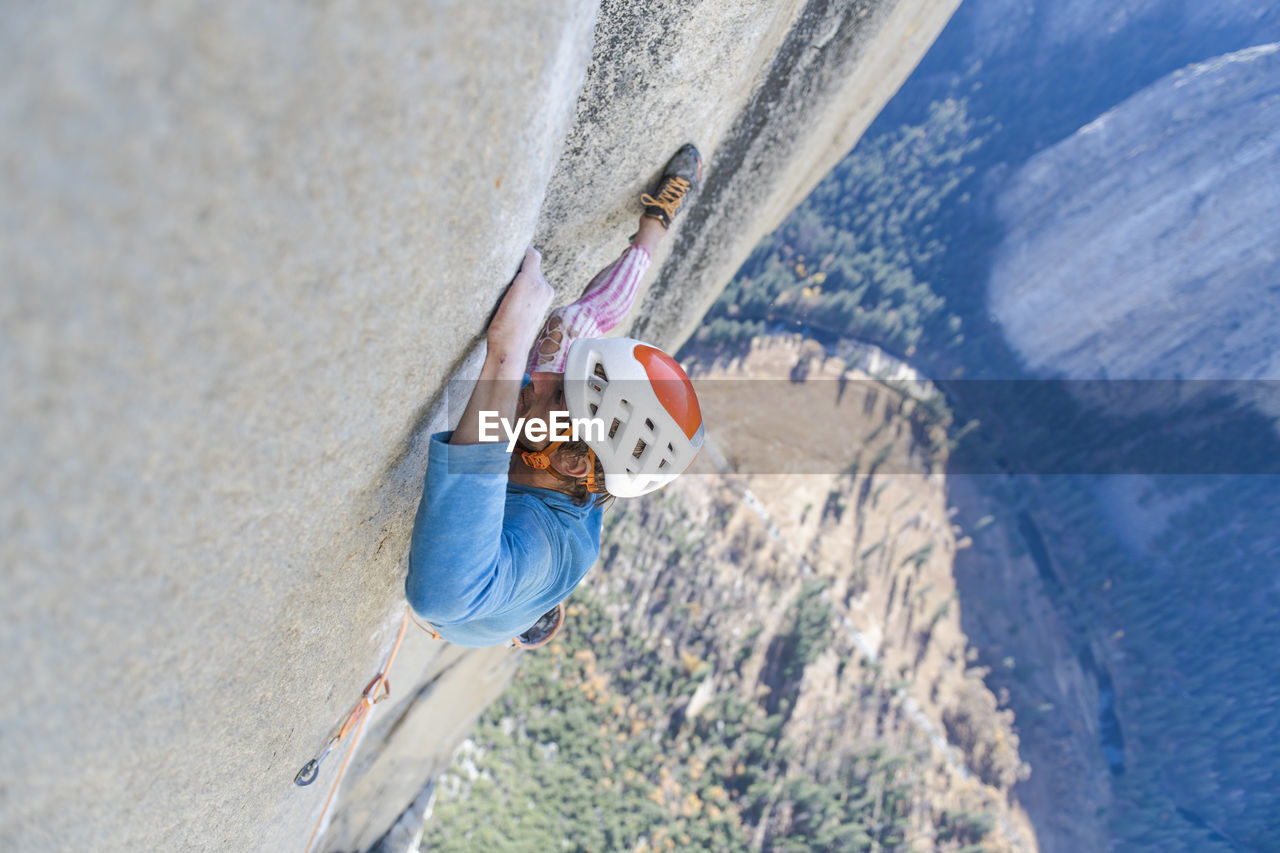 Rock climber crack climbing on the nose, el capitan in yosemite