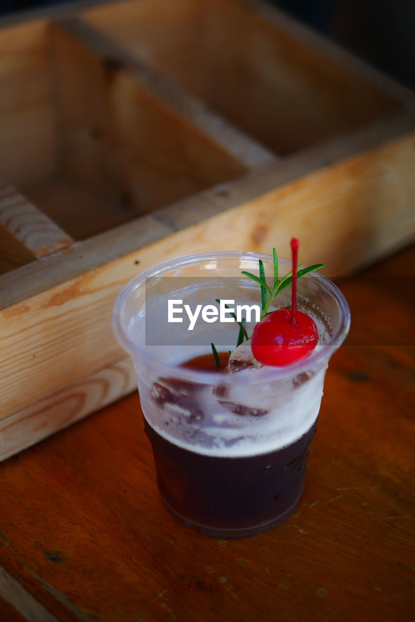 HIGH ANGLE VIEW OF STRAWBERRY AND DRINK ON TABLE