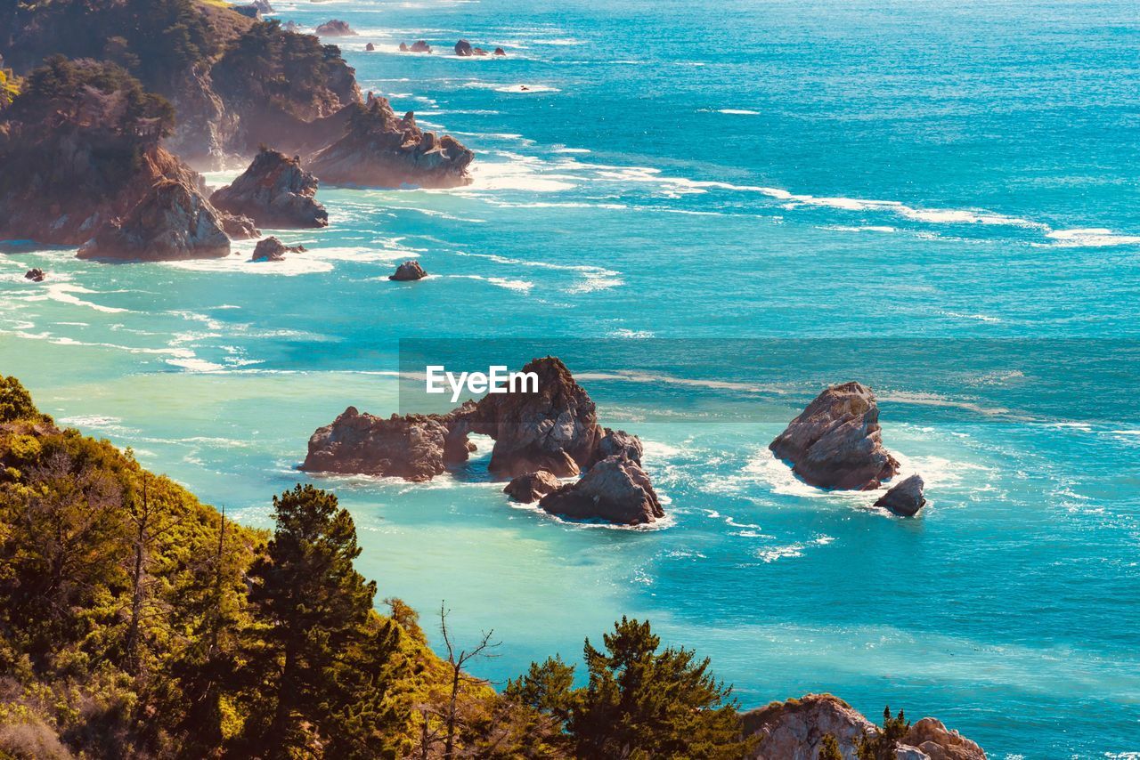 High angle view of rocks in sea