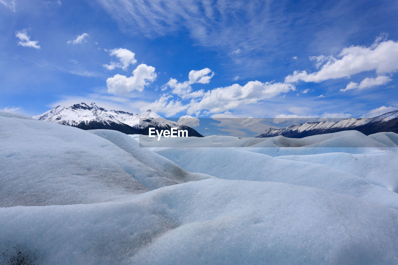 SNOWCAPPED LANDSCAPE AGAINST SKY