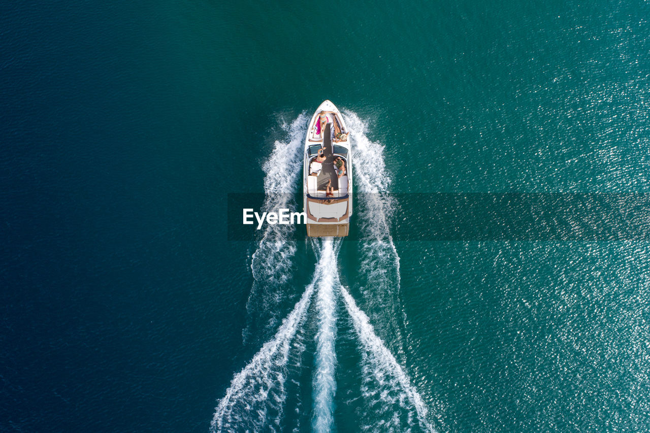 An aerial view of a group of friends power boating on lake tahoe, ca