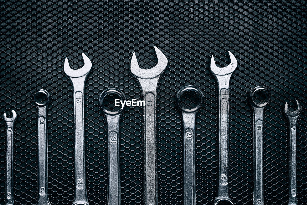 Set of chrome wrenches on steel surface. mechanic tools for maintenance. hardware tools to fix. tech