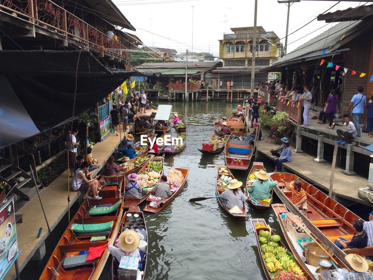 High angle view of local produce at damnoen saduak floating market in town