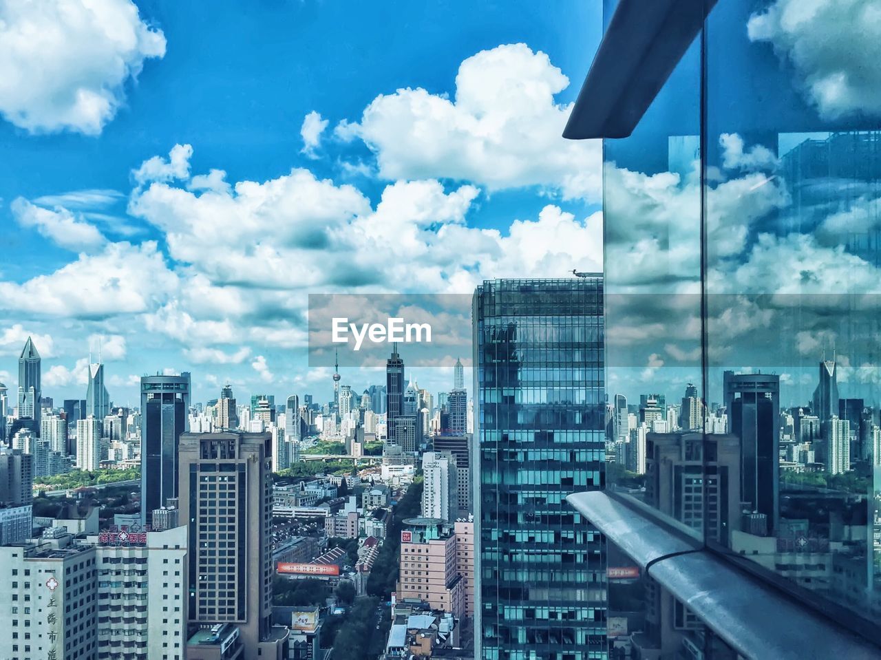 Cityscape reflection on huaihai international plaza window glass