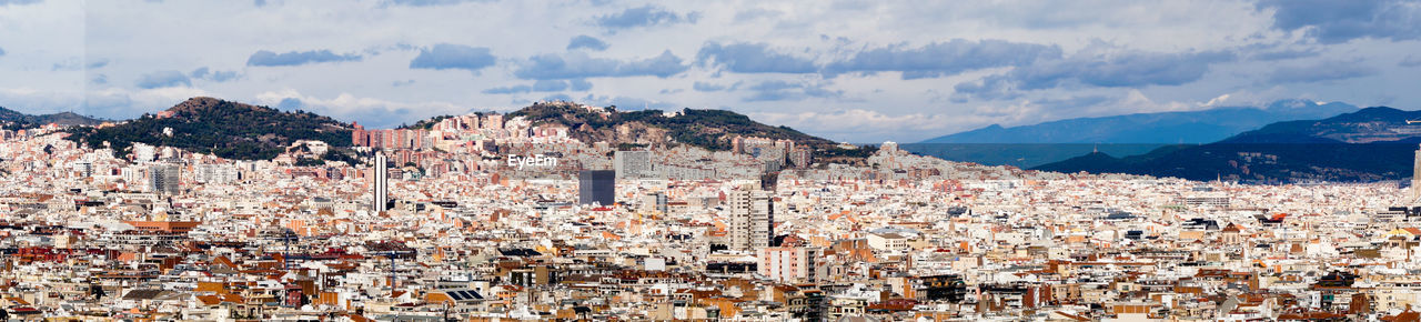 Panoramic shot of townscape against sky, barcelona 