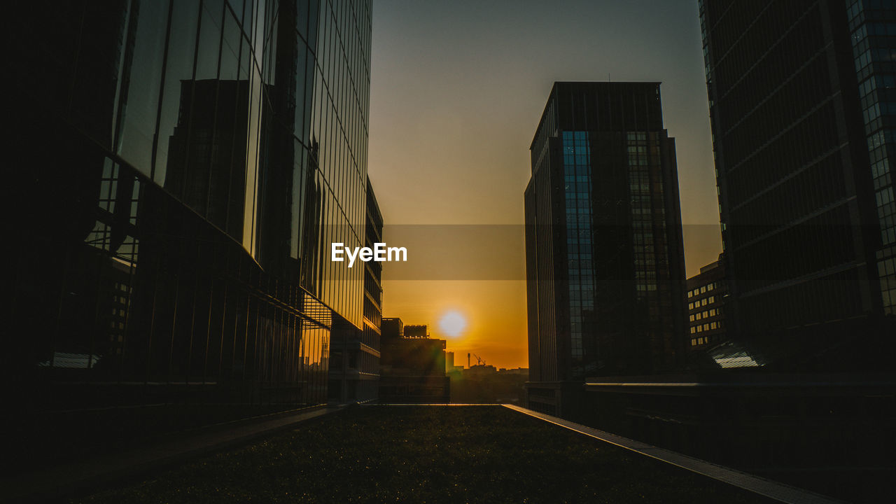 View of skyscrapers at sunset