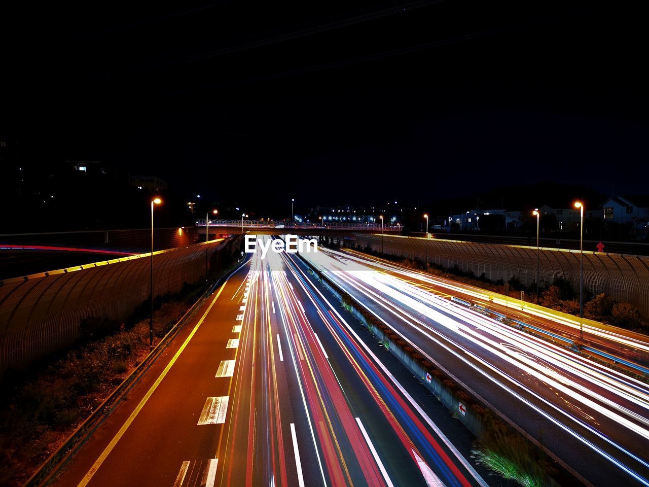 High angle view of light trails on road at night