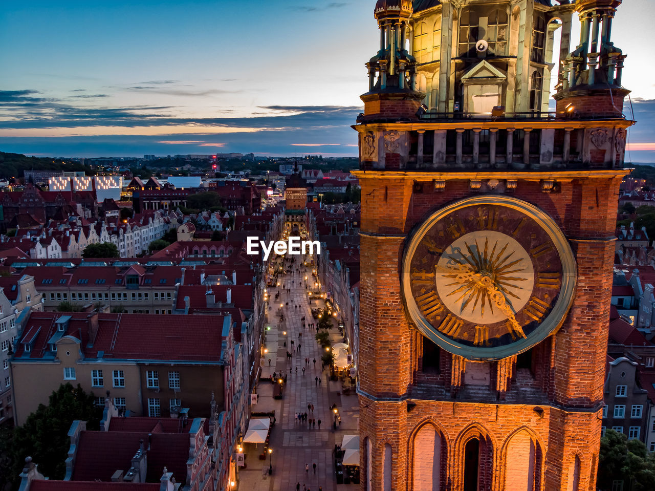 Clock tower in city at dusk