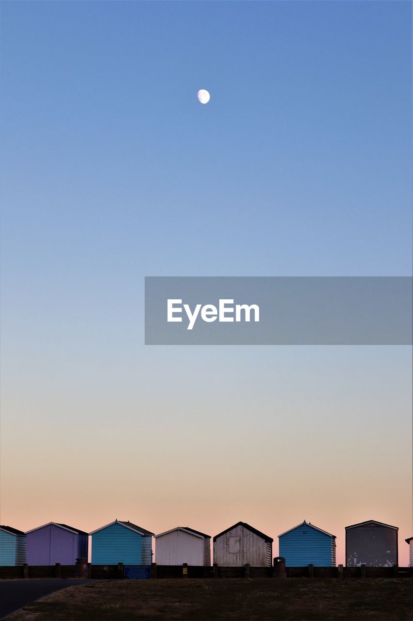 VIEW OF SEA AGAINST CLEAR SKY AT SUNSET