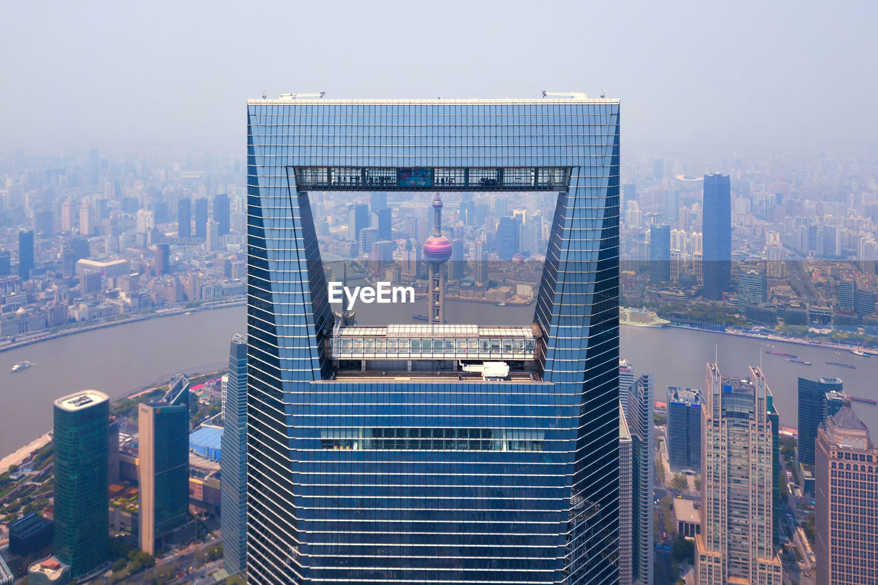 Modern buildings in city against clear sky