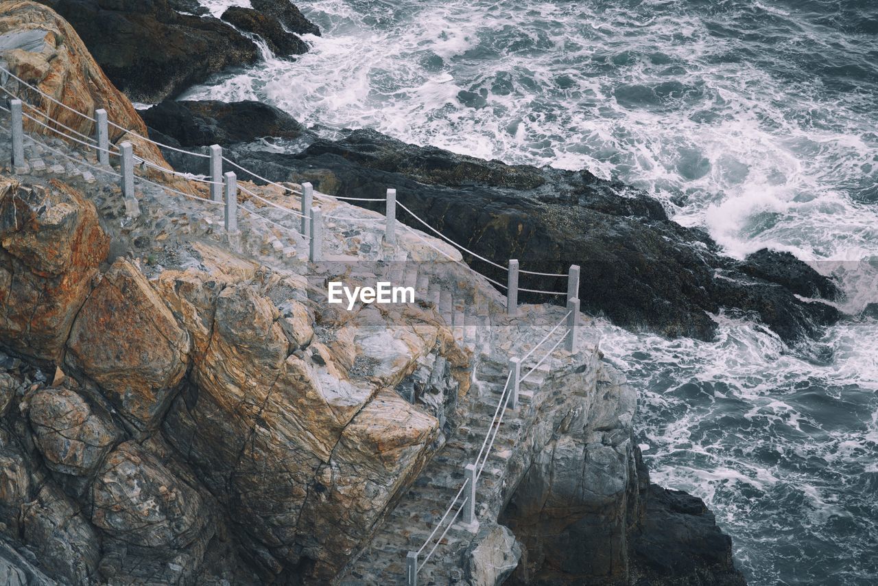 Stairs on cliff near ocean