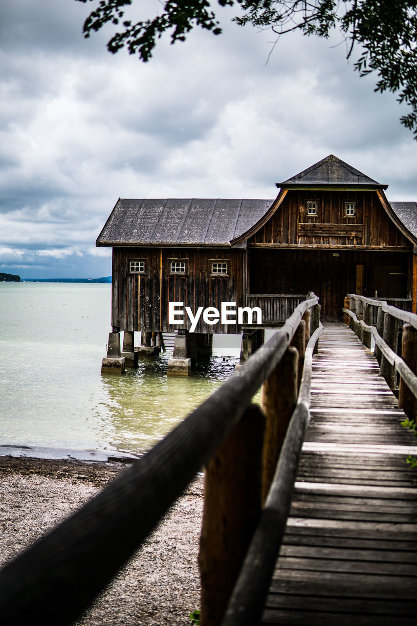 View of building by sea against sky
