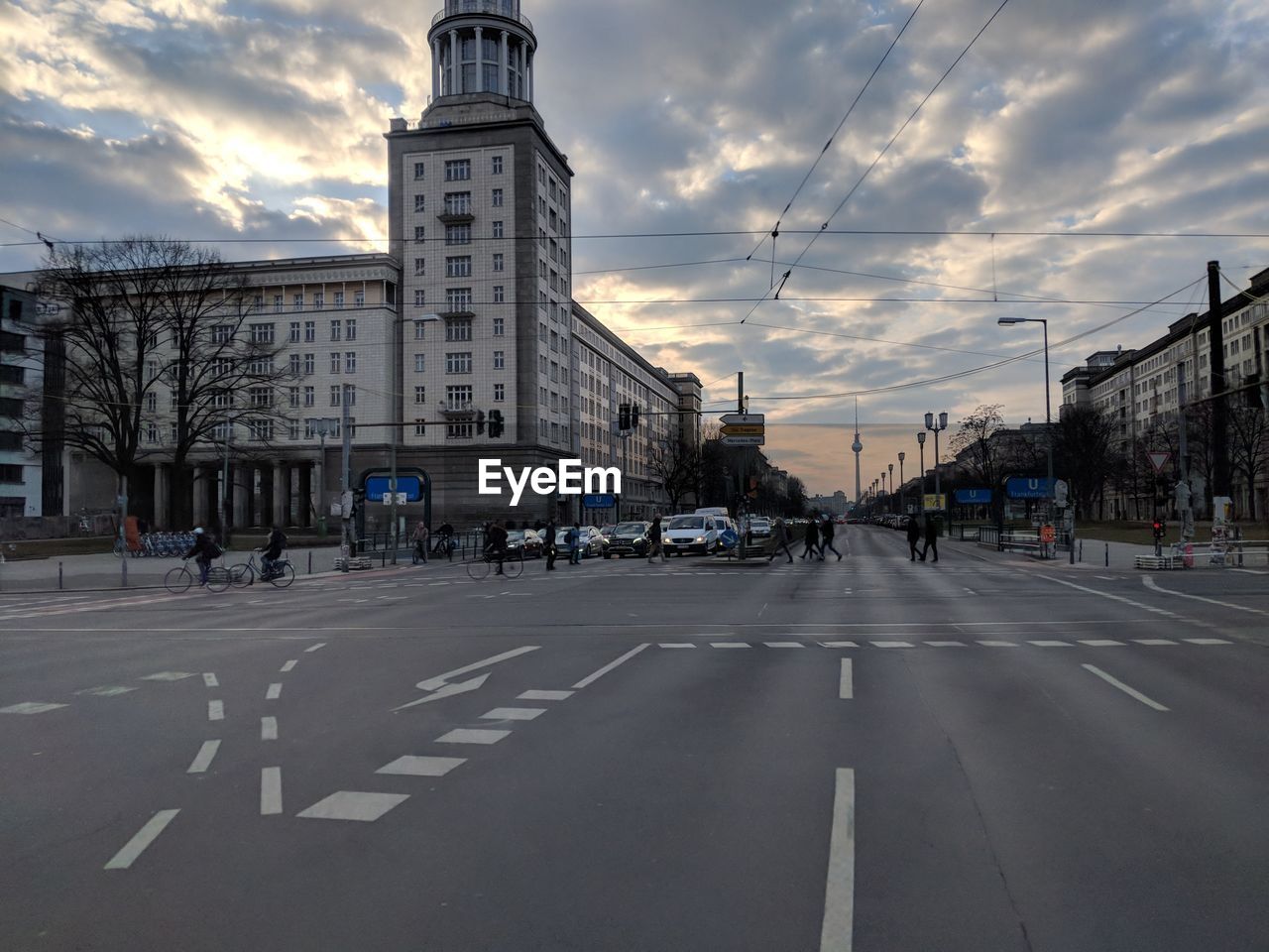 ROAD AMIDST BUILDINGS AGAINST SKY