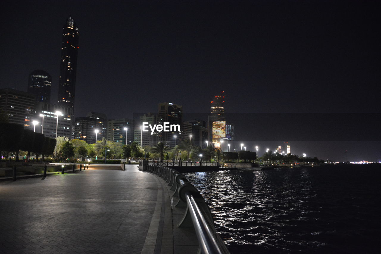 ILLUMINATED CITYSCAPE AT NIGHT