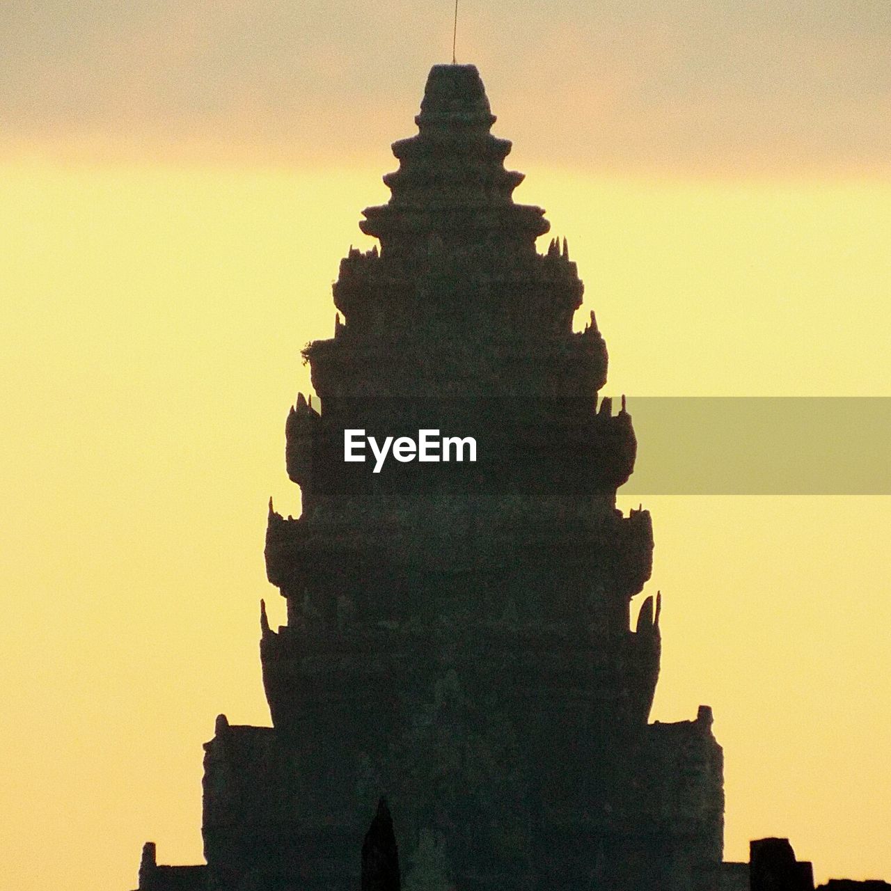 LOW ANGLE VIEW OF BUILT STRUCTURE AT SUNSET