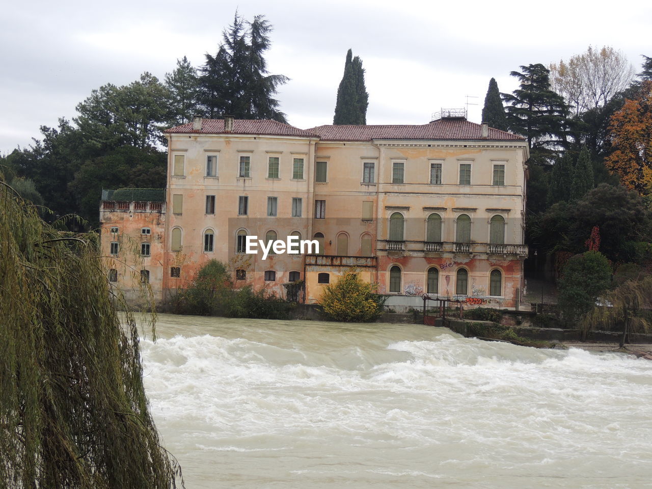 RIVER WITH BUILDINGS IN BACKGROUND