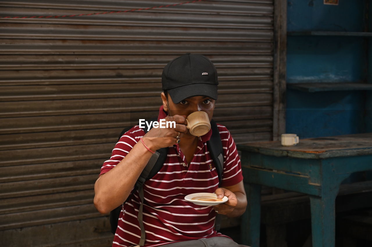 A man sipping hot tea at kolkata street