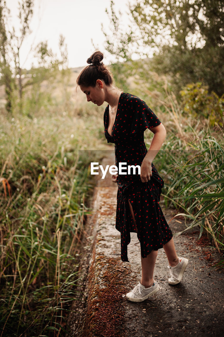 Full length of woman standing on land